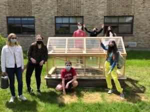 Students with micro greenhouse at SOMS