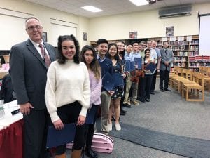BOE, superintendent and music students stand for posed group photo