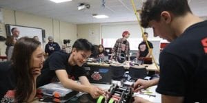 Team members working on robot
