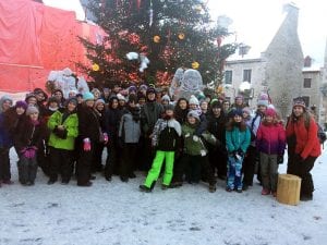 Middle school students outdoors in snowy Quebec