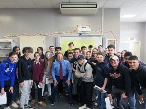 Sports Anchor Bruce Beck standing with TZHS students in classroom