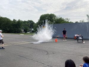 Teacher stands by science explosion outside