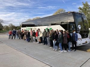 TZHS students standing in front of Go Jaspers bus