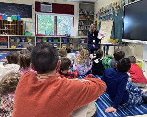 WOS co-teacher leads class read aloud
