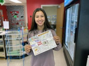 Nina V. with her advertisement sketch for the Sports Career Super Bowl Promotion Contest 