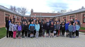 CLE students and administrators pose in new outdoor classroom