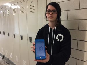 Student holding iPhone displaying water conservation app