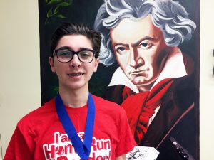 SOMS student Matt T. wearing third place medal won at Regional National History Day Contest