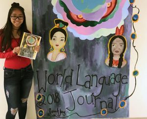 TZHS mural winner with mural and World Language Journal cover