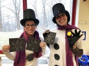 Two teachers dressed as snowmen